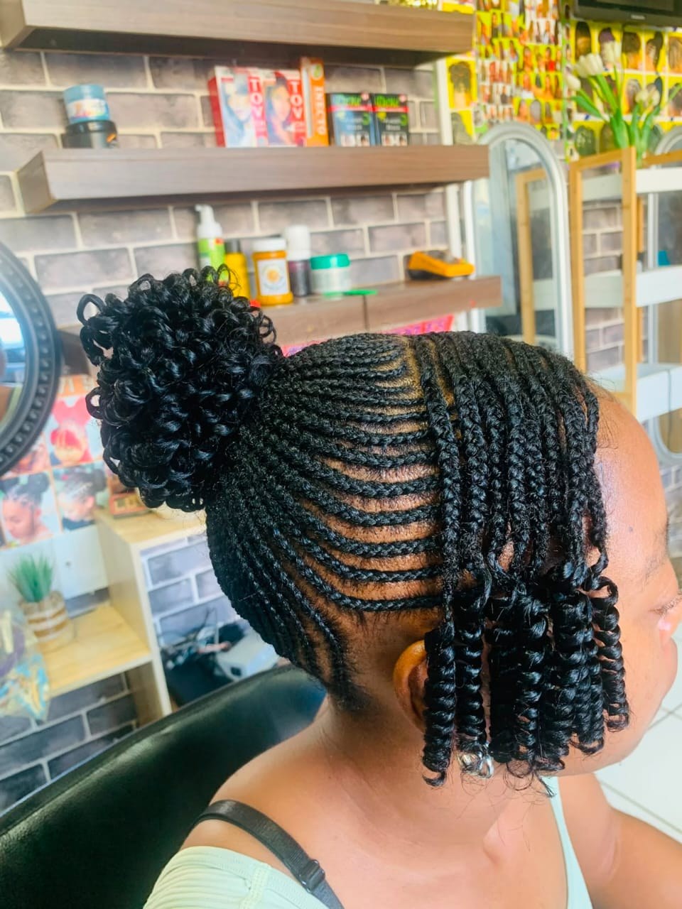 Cornrow and braid hairstyle with bun