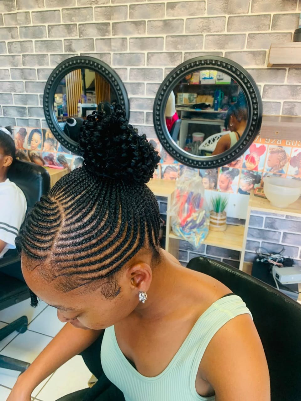 Detailed braided updo hairstyle from the back