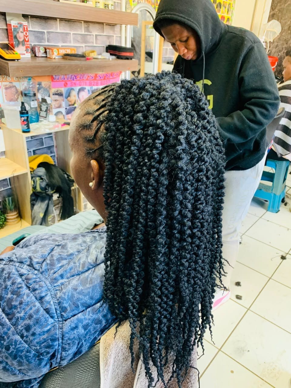 Long protective braids styled at the salon